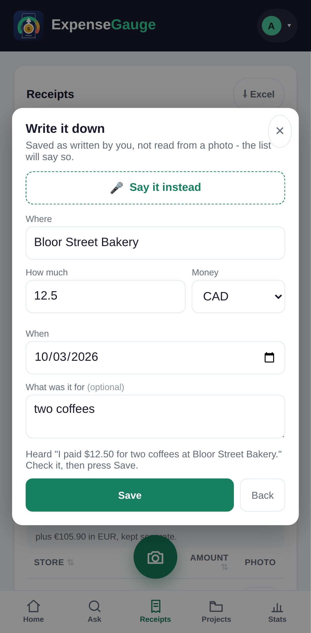 The Write it down form of ExpenseGauge on a phone, filled in from speech. A say it instead button sits at the top. The shop is Bloor Street Bakery, the amount 12.5 in Canadian dollars, the date 3 October 2026 and what it was for, two coffees. Beneath it: heard, I paid $12.50 for two coffees at Bloor Street Bakery, check it, then press save.